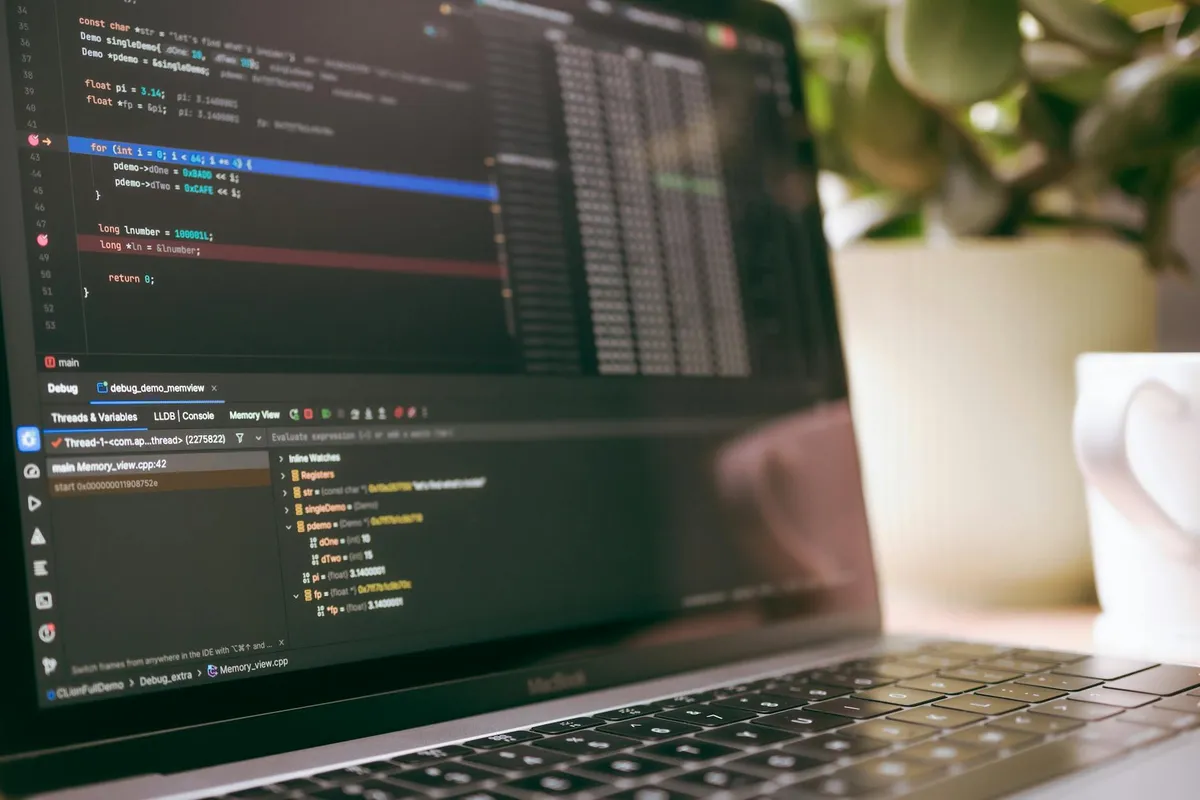 A developer troubleshooting code on a laptop